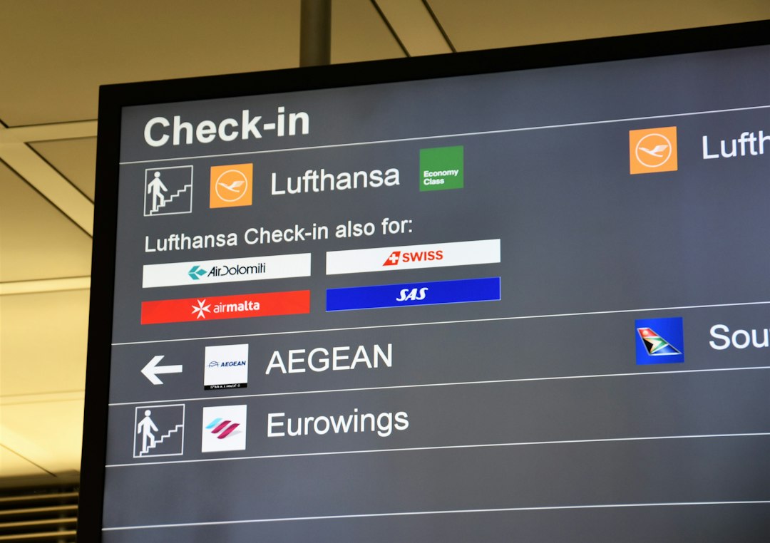 Digital flight information display board at an airport Digital flight information display board at an airport