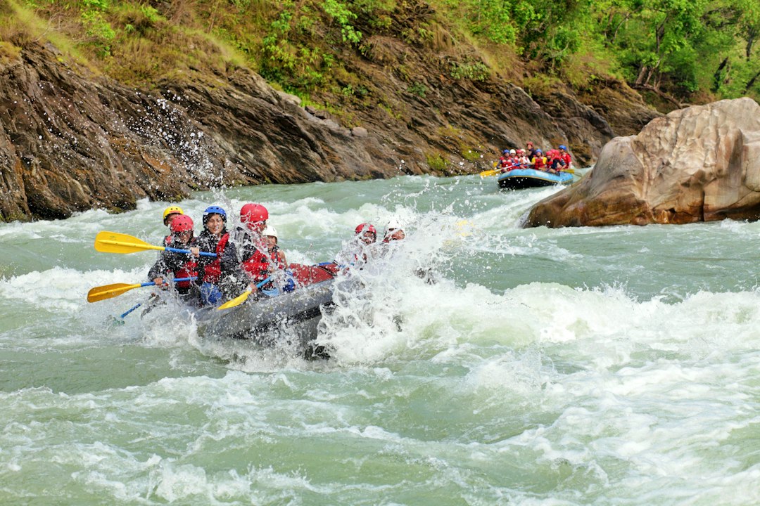 Group white-water rafting on a river Group white-water rafting on a river